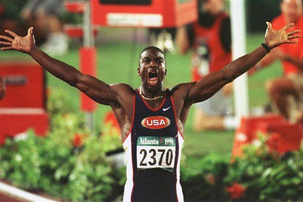 1 Aug 1996: Michael Johnson of the USA celebrates after his winning the men's 200 meters in a new world record time of 19.32 seconds in the Centennial Olympic Games at Olympic Stadium in Atlanta, Georgia. Johnson was the first man ever to win Olympic gol (Getty Images)