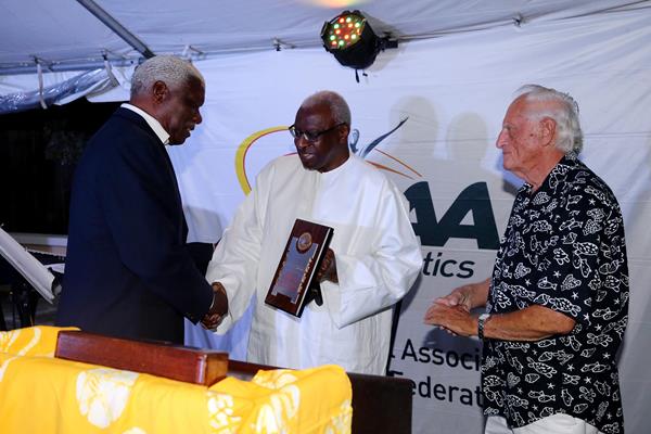 Mike Sands, Vice Chairman of the LOC receives an IAAF Hononary Plaque from President Diack at the IAAF/LOC dinner in Nassau; (Getty Images)