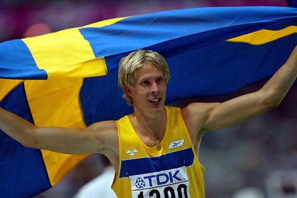 Christian Olsson flies the flag after winning the 2003 World title (Getty Images)