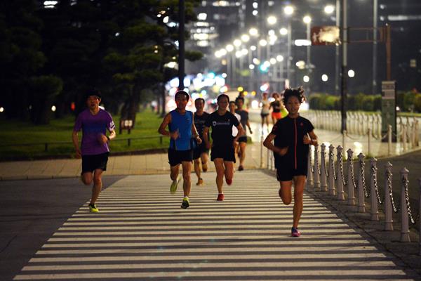 Running around Tokyo's Imperial Palace Gardens at night (AFP / Getty Images)