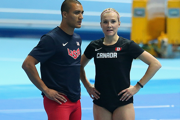 Brianne Theisen-Eaton talks to husband Ashton Eaton in between events at the 2014 IAAF World Indoor Championships in Sopot (Getty Images)