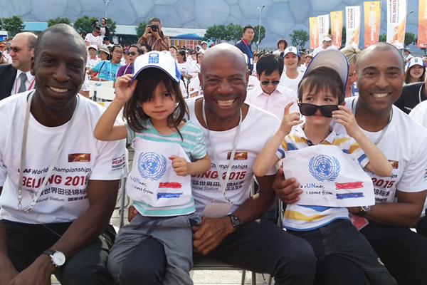 Michael Johnson, Mike Powell and Colin Jackson with local school children at the 100-day countdown ceremony (IAAF)