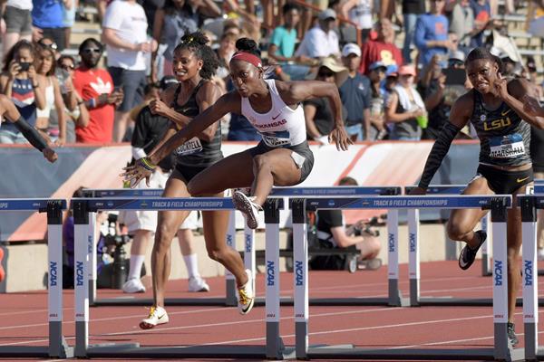 Janeek Brown on her way to winning the 100m hurdles at the NCAA Championships (Kirby Lee)