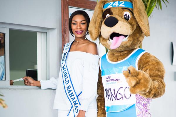 Miss Bahamas Ashley Hamilton and the relay's mascot, Bingo, purchase the first World Relays 2017 ticket (Bahamas 2017 LOC)
