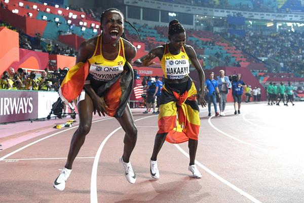 All smiles - Halimah Nakaayi and Winnie Nanyondo celebrate after the women's 800m final in Doha (AFP/Getty Images)
