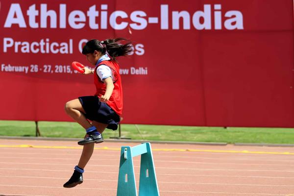 A young girl runs over the hurdles at the IAAF / Nestlé Kids’ Athletics workshop in New Delhi (AFI)
