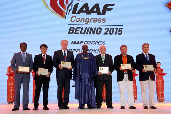 IAAF President Lamine Diack with IAAF Plaque of Merit recipients Vivian Gungaram, Tigor Tanjung, Karel Pilny, Keith Parker, Naomi Pollum (represented by Toni Green) and Lino Ramiro Varela Marmolejo at the Opening Ceremony and Dinner for the 50th IAAF Congress at the Great Hall of the People in Beijing (Getty Images)