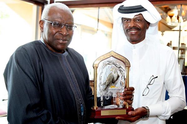 IAAF president Lamine Diack presents Talal Mansour with a commemorative crystal trophy (Laurel)