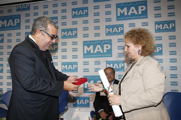 Jamila Benchrif receives the Wissam Royal de l'Ordre de Mérite National de la Première Catégorie award on behalf of her husband Mohamed Benchrif ()