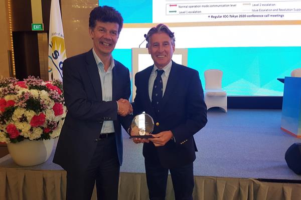 IAAF President Sebastian Coe receives the Sportcal Global Sports Event of the Year award from managing director Mike Laflin (Sportcal)