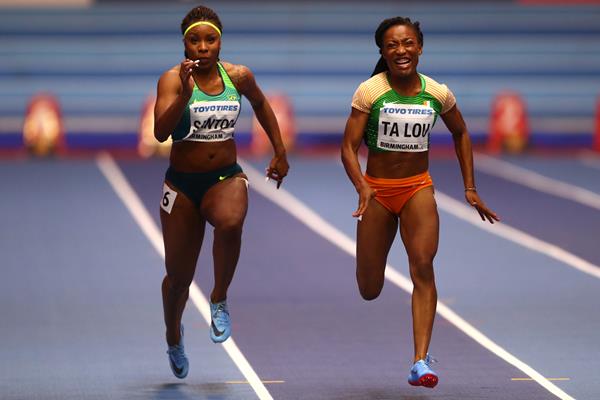 Marie-Josee Ta Lou (r) of Cote dIvoire and Rosangela Santos (l) of Brazil in the opening round of the women's 60m in Birmingham (Getty Images)