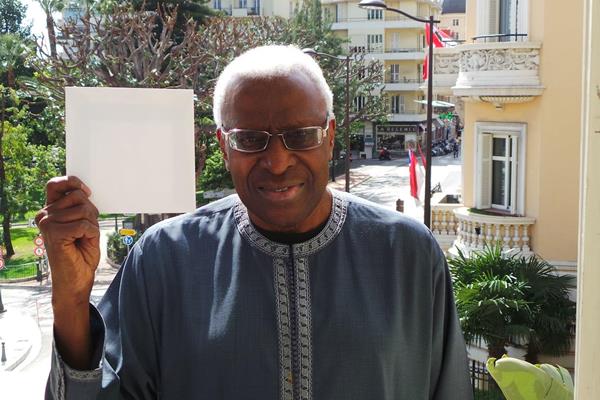 IAAF President Lamine Diack holds up a white card for peace (IAAF)