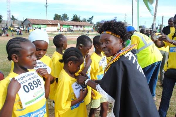 Tegla Loroupe helps the girls before their race in Kapenguria (TLPF)