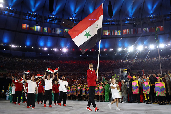Majd Eddin Ghazal carries the Syrian flag during the opening ceremony of the Rio 2016 Olympic Games (Getty Images)