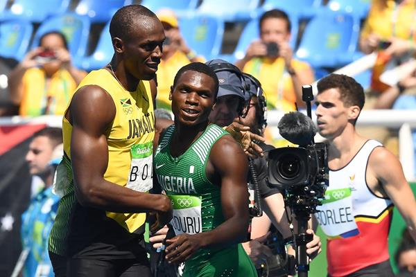 Usain Bolt and Divine Oduduru after their 200m heat at the Rio 2016 Olympic Games (AFP / Getty Images)