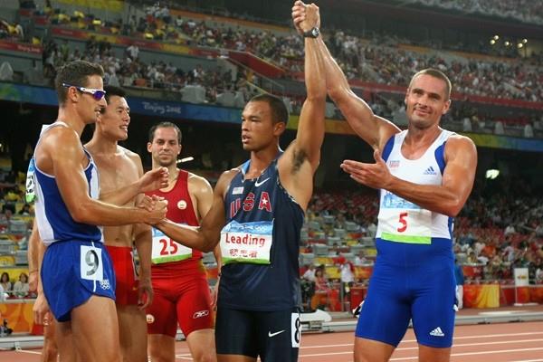 The changing of the guard: 2004 Olympic decathlon champion Roman Sebrle salutes the new champion, Bryan Clay (Getty Images)