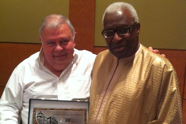 Roberto Gesta de Melo, Area Representative for South America on the IAAF Council, presents President Lamine Diack with a plaque to mark his support for the Brazilian Federation during the 26 years that Mr. De Melo was the federation's President. Roberto Gesta de Melo stood down from the position earlier this year. (IAAF)