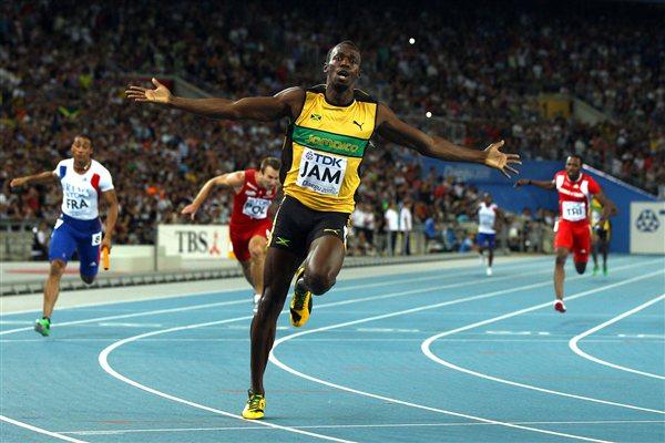 Usain Bolt of Jamaica celebrates victory and a new world record in the men's 4x100 metres relay final (Getty Images)