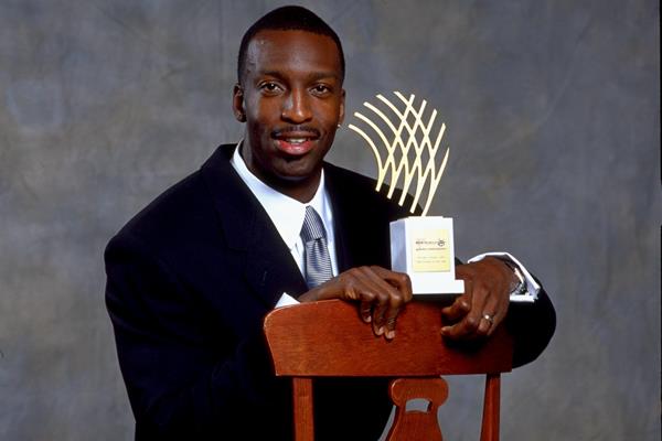Michael Johnson with his 1999 Athlete of the Year award (Getty Images)