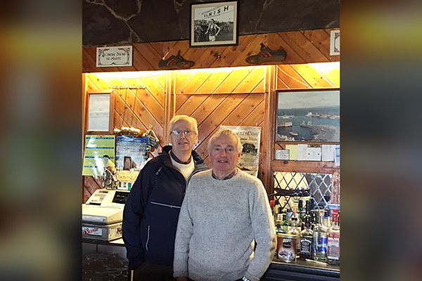 John Treacy (left) with his cousin (right) at the bar where his spikes from the 1978 World Cross have been for the past 41 years (John Treacy)
