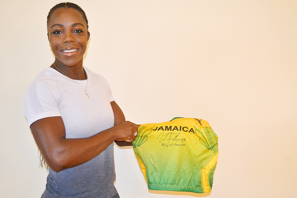 Veronica Campbell-Brown with her vest from the Athens 2004 Olympic Games (IAAF)