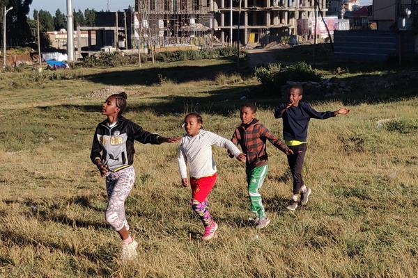 Young runners in a field in the suburbs of Addis Ababa (Cathal Dennehy)