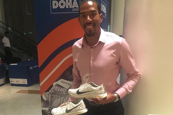 Christian Taylor with the spikes he's donated to the IAAF Heritage collection (IAAF)