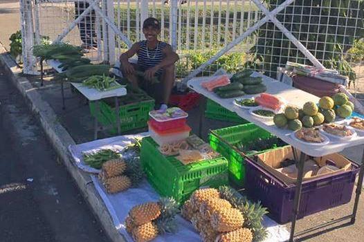 Fijian cross country runner Avikash Lal at his family's fruit stand (Avikash Lal)