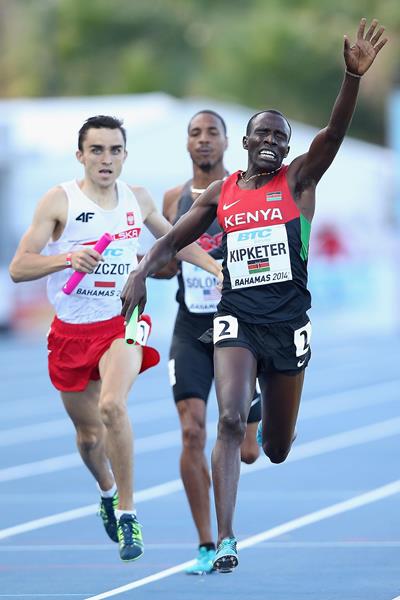 Alfred Kipketer of Kenya celebrates as he crosses the finish line ahead of Adam Kszczot of Poland to win the Mens 4x800 metres relay during day one of the IAAF World Relays (Getty Images)