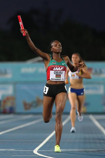 Hellen Onsando Obiri of Kenya celebrates as she crosses the finish line to win and set a new world record of 16:33.58 in the Women's 4x1500 metres relay (Getty Images)