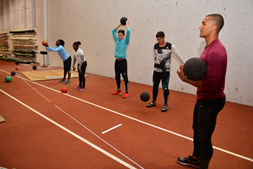The 'On Camp' group do medicine ball drills with Ashton Eaton (Phil Johnson / TrackTown USA)