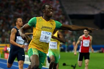 Usain Bolt points at the clock after his 19.19 world record-breaking run at the 2009 World Championships in Berlin (Getty Images)