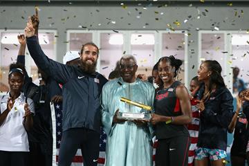 IAAF President Lamine Diack awards the Golden Baton to the USA, the overall best team at the inaugural IAAF World Relays (Getty Images)