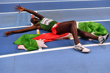 Francine Niyonsaba collapses in delight after successfully defending her 800m title at the IAAF World Indoor Championships Birmingham 2018 ()