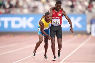 Braima Suncar Dabo (r) helping Jonathan Busby of Aruba to the finish of the their heat in the 5000m at the IAAF World Athletics Championships Doha 2019 (Getty Images)