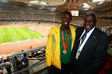 Usain Bolt and Lamine Diack and the backdrop of a full to capacity Olympic stadium in Beijing (Getty Images)