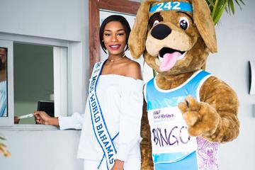 Miss Bahamas Ashley Hamilton and the relay's mascot, Bingo, purchase the first World Relays 2017 ticket (Bahamas 2017 LOC)