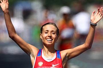 Gold medalist Olga Kaniskina of Russia celebrates as she crosses the finish line during the women's 20km race walk during day five (Getty Images)