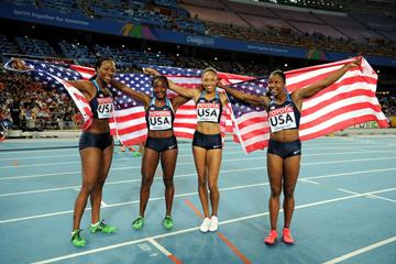 (L-R) Allyson Felix, Bianca Knight, Marshevet Myers and Carmelita Jeter of the USA celebrate victory in the women's 4x100 metres relay final (Getty Images)