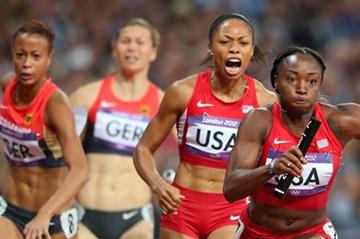 Bianca Knight of the United States receives he relay baton fom Allyson Felix of the United States on their way to winning gold in the Women's 4 x 100m Relay Final of the London Olympic Games on 10 August 2012 (Getty Images)