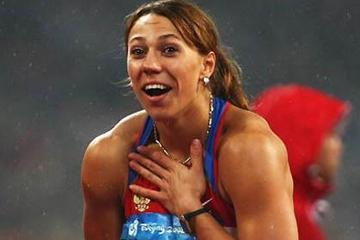 Mariya Abakumova looks with surprise and delight at her 70.78m release in Beijing (Getty Images)