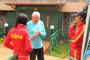 Italian distance-running coach Renato Canova speaks to two of the Chinese athletes in his training group (Jon Rosen)