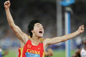 Liu Xiang equals the World record to take gold in the 110m Hurdles in Athens (Getty Images)