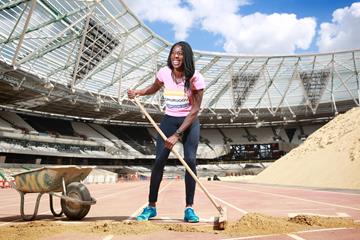 Christine Ohuruogu removing the final protective layer of soil from the finish line in London's Olympic Stadium (British Athletics)