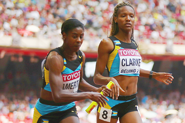 Christine Amertil takes the baton from Lanece Clarke in the 4x400m at the IAAF World Championships Beijing 2015 (Getty Images)