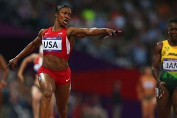 Carmelita Jeter of the United States celebrates winning gold ahead of Kerron Stewart of Jamaica and set a new World Record in the Women's 4 x 100m Relay Final  of the London 2012 Olympic Games on 10 August 2012 (Getty Images)