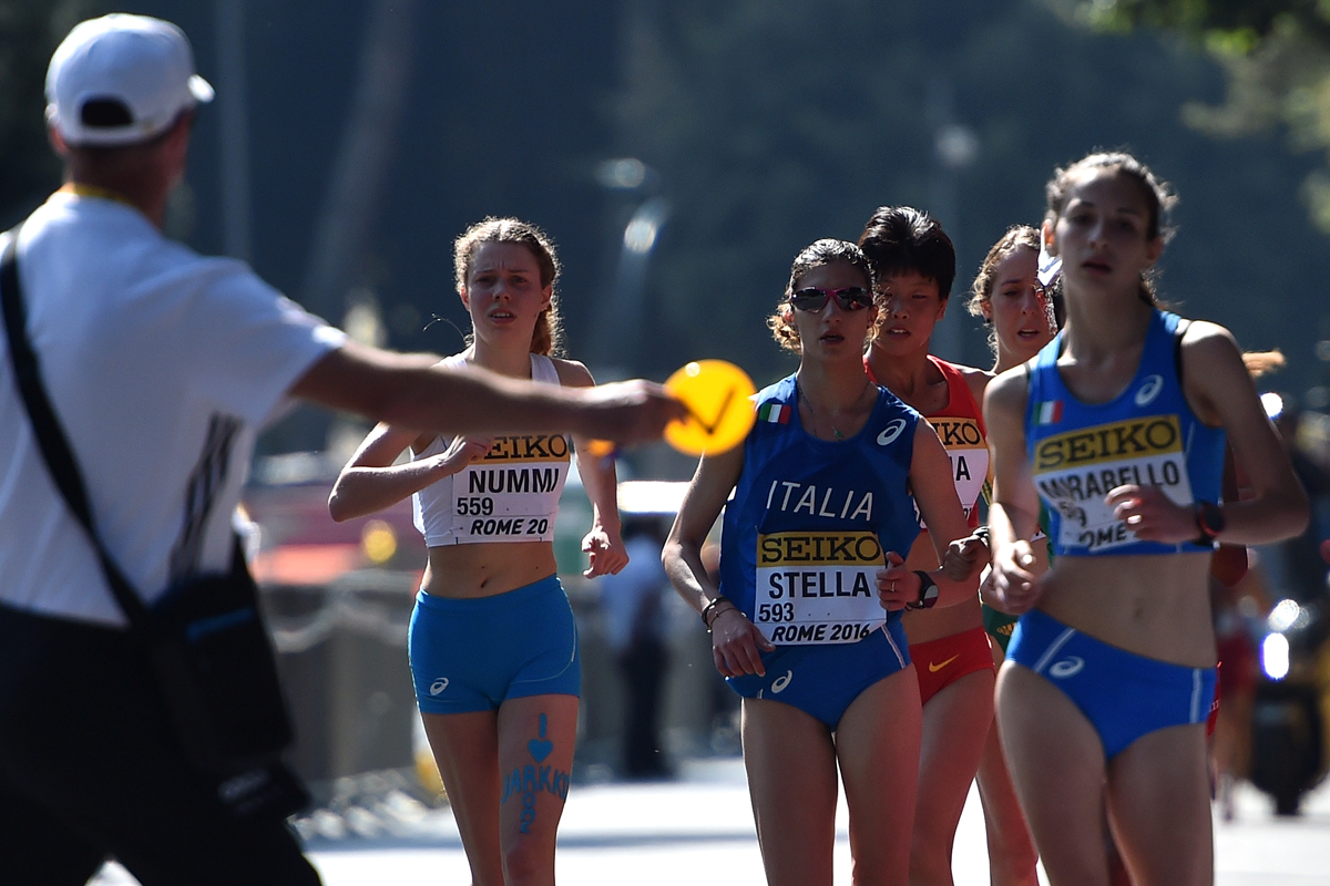 Race walkers are shown a warning card (Getty Images)