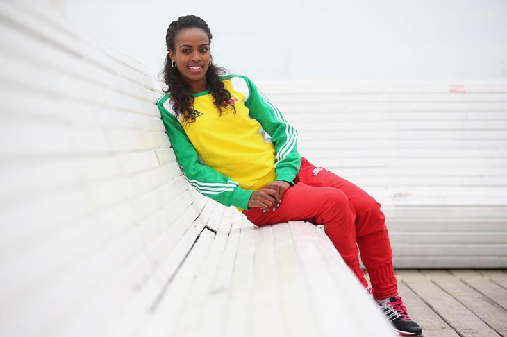 Genzebe Dibaba sitting on a bench on the pier ahead of Sopot 2014 ()